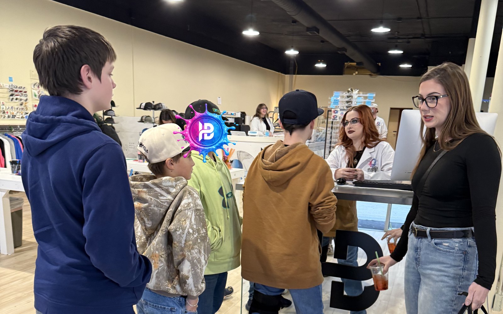 Customers being served at the counter inside the BRANDLAB shop in Redmond